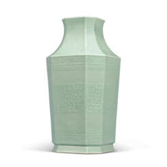 A FINE AND RARE MOULDED CELADON-GLAZED ‘DRAGON AND PHOENIX’ OCTAGONAL VASE