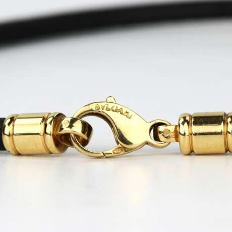 Bulgari gold pendant with diamonds, in the form of a heart on a rubber strap. - photo 9