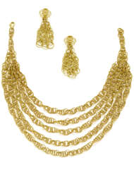 GIANMARIA BUCCELLATI | Yellow chiseled gold "Hawaii" jewellery set comprising cm 35.00 circa necklace with a five strand centerpiece and cm 7.40 circa intertwined pendant earrings, in all g 122.89 circa. Signed and marked Gianmaria Buccellati, 18K It