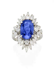 Oval ct. 11.50 circa sapphire, round and marquise diamond platinum ring, diamonds in all ct. 2.20 circa, g 13.78 circa size 17/57. | | Appended gemmological report CISGEM n. 27267 19/03/2024, Milano