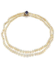 Two strand natural slightly irregular saltwater pearl graduated necklace accented with cabochon ct. 3.30 circa sapphire, diamond, yellow gold and silver clasp, mm 4.20 to mm 6.60 circa pearls, diamonds in all ct. 1.10 circa, g 33.40 circa, length cm 