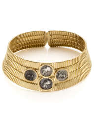 BULGARI | Yellow gold tubogas choker accented with four silver Staters of Corinth coins, g 334.78 circa, diam. cm 11.50 circa. Signed Bvlgari and with logo.