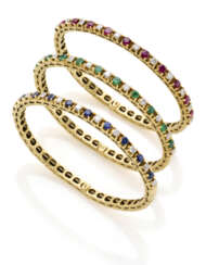 Three diamond, emerald, ruby, sapphire and yellow gold bangle bracelets, diamonds in all ct. 2.00 circa, in all g 57.82 circa, diam. cm 4.5 circa.