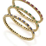Three diamond, emerald, ruby, sapphire and yellow gold bangle bracelets, diamonds in all ct. 2.00 circa, in all g 57.82 circa, diam. cm 4.5 circa. - фото 1
