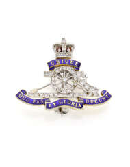 Diamond, enamel and bi-coloured 9K gold Royal Artillery Regiment brooch, g 4.82 circa, length cm 3.00 circa. British hallmarks.