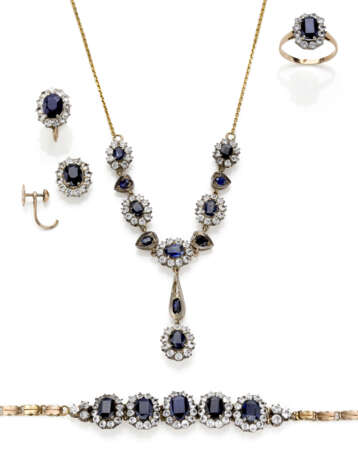 Oval sapphire, colourless stone, yellow 9K gold, silver and metal jewellery set comprising cm 50.50 circa necklace with centerpiece, cm 18.00 circa bracelet, cm 1.60 circa earrings and size 13/53 ring, sapphires in all ct. 12.60 circa, in all g 23.69 - photo 1