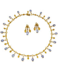 Diamond, blue and yellow sapphire yellow gold jewellery set comprising cm 39.70 circa necklace and cm 3.60 circa pendant earrings, diamonds in all ct. 2.00 circa, blue shappires in all ct. 18.50 circa, in all g 39.14 circa.
