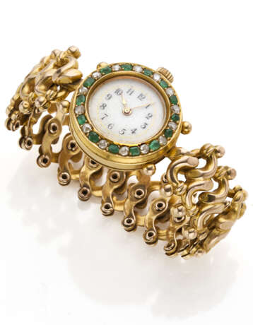 Yellow 14K gold lady's wristwatch accented with emeralds and rose cut diamonds, folding bracelet, g 30.74 circa, diam. cm 5.50 circa. Swiss assay marks inside the case. (slight defects) - фото 1