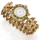 Yellow 14K gold lady's wristwatch accented with emeralds and rose cut diamonds, folding bracelet, g 30.74 circa, diam. cm 5.50 circa. Swiss assay marks inside the case. (slight defects) - Foto 1