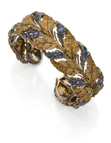 BUCCELLATI | Sapphire, gold and silver leaf shaped bangle bracelet, g 52.83 circa, diam. cm 6 circa. Signed Buccellati, 750. (slight defects) - фото 1