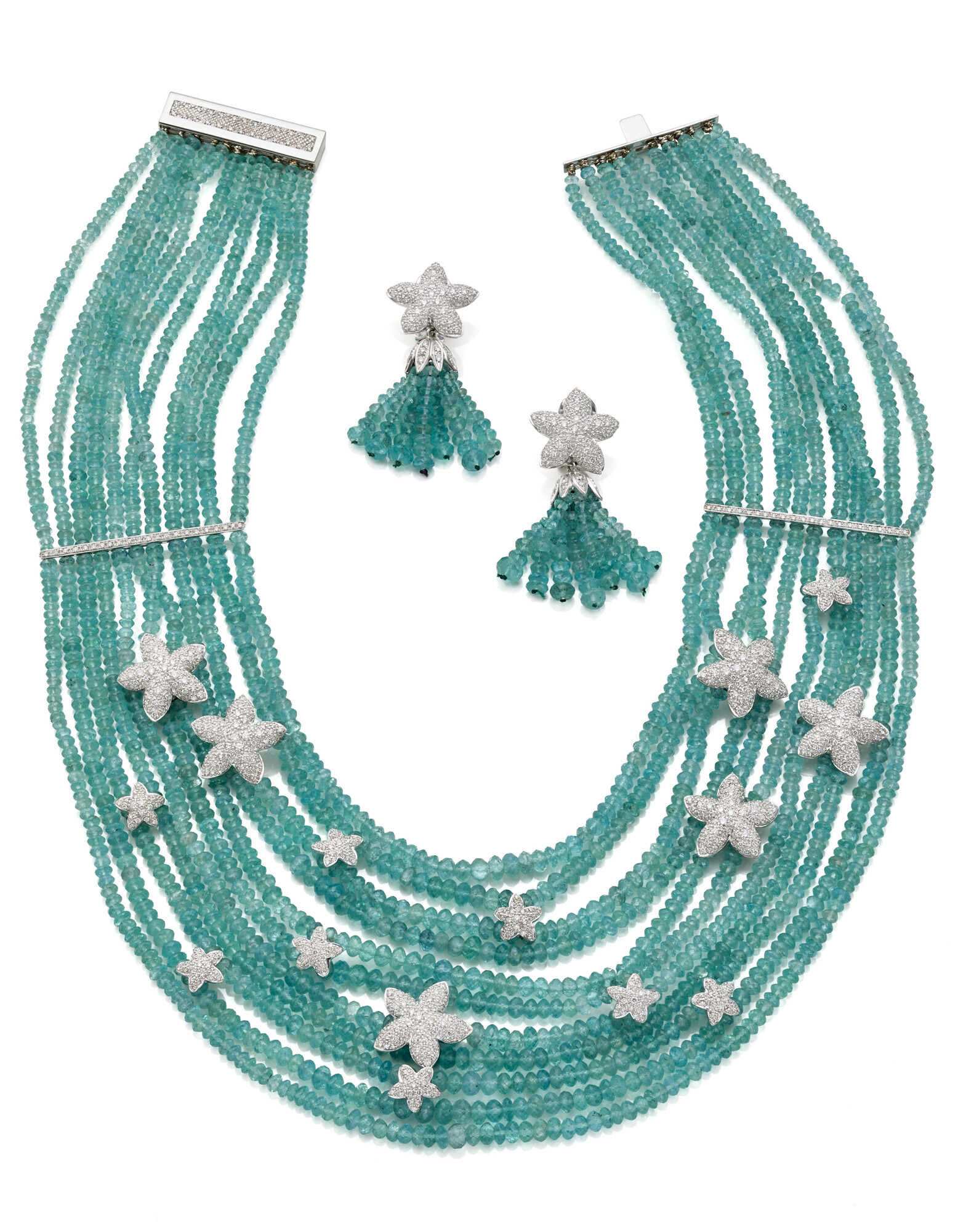 Aquamarine bead, diamond and white gold jewellery set comprising cm 42.50 circa multi-strand necklace with spacers together with cm 5.30 circa tassel pendant earrings, diamonds in all ct. 6.10 circa, in all g 244.37 circa. (slight defects)