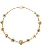 Каталог товаров. Yellow gold chain necklace with chiseled flower spacers accented with diamonds, in all ct. 0.60 circa, g 27.43 circa, length cm 42.0 circa.