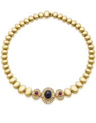 Yellow gold modular necklace accented with round and carré diamond, cabochon ct. 10.70 circa sapphire and ruby centerpiece, diamonds in all ct. 2.90 circa, rubies in all ct. 1.60 circa, g 108.01 circa, length cm 39.5 circa.