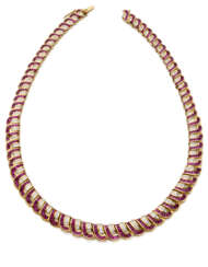 Calibré ruby and diamond yellow gold ribbon necklace, diamonds in all ct. 4.10 circa, g 68.88 circa, length cm 40.04 circa. French assay and goldsmith marks.