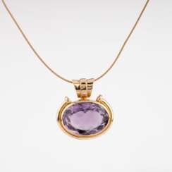 An Amethyst Pendant on Gold Necklace.