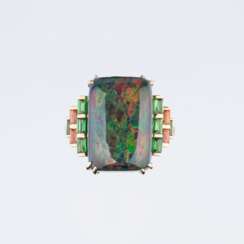 An Opal Ring with Diamonds and Precious Stones.