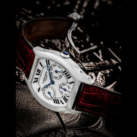 CARTIER. A RARE 18K WHITE GOLD TONNEAU-SHAPED AUTOMATIC PERPETUAL CALENDAR WRISTWATCHWITH LEAP YEAR INDICATION - photo 1