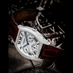 CARTIER. A RARE 18K WHITE GOLD TONNEAU-SHAPED AUTOMATIC PERPETUAL CALENDAR WRISTWATCHWITH LEAP YEAR INDICATION