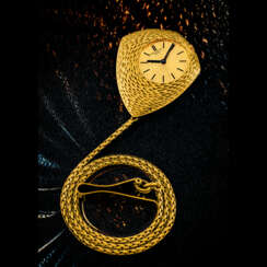 PATEK PHILIPPE. AN UNUSUAL AND RARE 18K GOLD ASYMMETRICAL POCKET WATCH WITH 18K GOLD MATCHING CHAIN