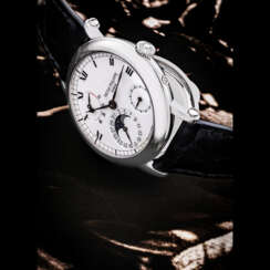 PATEK PHILIPPE. A PLATINUM AUTOMATIC WRISTWATCH WITH MOON PHASES, POWER RESERVE AND DATE