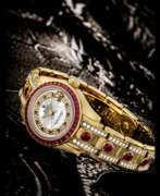 Mouvement mécanique. ROLEX. A LADY&#39;S ATTRACTIVE AND VERY RARE 18K GOLD, DIAMOND AND RUBY-SET AUTOMATIC WRISTWATCH WITH SWEEP CENTRE SECONDS, DATE, BRACELET AND MOTHER-OF-PEARL DIAL