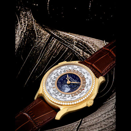 PATEK PHILIPPE. A LADY’S 18K PINK GOLD AND DIAMOND-SET LIMITED EDITION AUTOMATIC WORLD TIME WRISTWATCH WITH MOON PHASES, MADE TO COMMEMORATE THE 175TH ANNIVERSARY OF PATEK PHILIPPE - photo 1