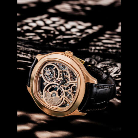 PIAGET. AN 18K PINK GOLD AUTOMATIC SKELETONISED TOURBILLON WRISTWATCH - photo 1