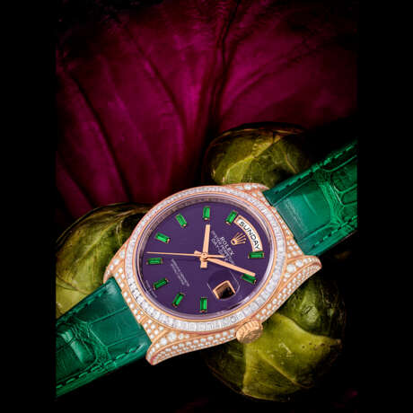 ROLEX. A RARE 18K PINK GOLD, DIAMOND AND GREEN GEMSTONE-SET AUTOMATIC WRISTWATCH WITH SWEEP CENTRE SECONDS, DAY, DATE AND PURPLE HARD STONE DIAL - photo 1