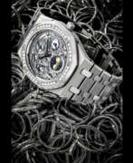 Übersicht. AUDEMARS PIGUET. A RARE AND ATTRACTIVE STAINLESS STEEL, PLATINUM AND DIAMOND-SET SEMI-SKELETONISED AUTOMATIC PERPETUAL CALENDAR WRISTWATCH WITH MOON PHASES, LEAP YEAR INDICATION AND BRACELET