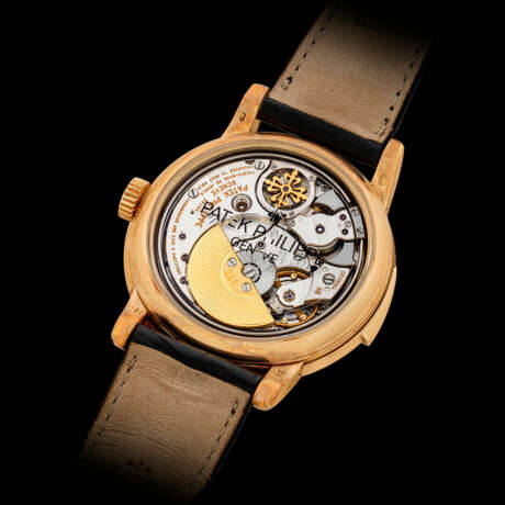 PATEK PHILIPPE. A VERY RARE 18K GOLD AUTOMATIC MINUTE REPEATING PERPETUAL CALENDAR WRISTWATCH WITH MOON PHASES, 24 HOUR, LEAP YEAR AND DAY/NIGHT INDICATION, CASE MADE BY JEAN-PIERRE HAGMANN, MADE TO CELEBRATE THE 150THANNIVERSARY OF PATEK PHILIPPE IN 1989 - фото 2