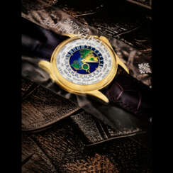 PATEK PHILIPPE. A RARE 18K GOLD AUTOMATIC WORLD TIME WRISTWATCH WITH CLOISONN&#201; ENAMEL DIAL, SINGLE SEALED