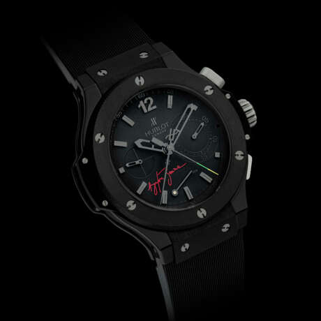 HUBLOT. A RARE BLACK CERAMIC, KEVLAR AND RUBBER LIMITED EDITION AUTOMATIC SPLIT-SECONDS CHRONOGRAPH WRISTWATCH WITH POWER RESERVE INDICATION - фото 1