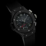 HUBLOT. A RARE BLACK CERAMIC, KEVLAR AND RUBBER LIMITED EDITION AUTOMATIC SPLIT-SECONDS CHRONOGRAPH WRISTWATCH WITH POWER RESERVE INDICATION - Foto 1