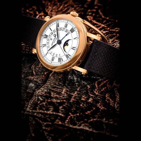 PATEK PHILIPPE. AN 18K PINK GOLD AUTOMATIC PERPETUAL CALENDAR WRISTWATCH WITH SWEEP CENTRE SECONDS, RETROGRADE DATE, MOON PHASES AND LEAP YEAR INDICATION - photo 1