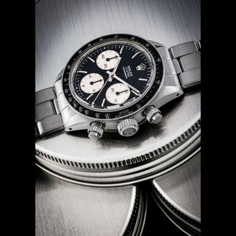 ROLEX. A RARE AND ATTRACTIVE STAINLESS STEEL CHRONOGRAPH WRISTWATCH WITH “SIGMA” DIAL AND BRACELET - Foto 1