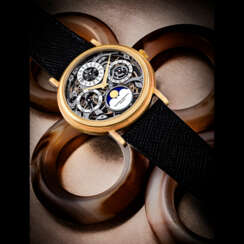 VACHERON CONSTANTIN. AN 18K GOLD AUTOMATIC SKELETONISED PERPETUAL CALENDAR WRISTWATCH WITH MOON PHASES