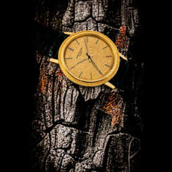 PATEK PHILIPPE. AN 18K GOLD AUTOMATIC WRISTWATCH WITH SWEEP CENTRE SECONDS