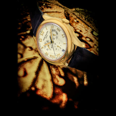 PATEK PHILIPPE. AN 18K GOLD AUTOMATIC ANNUAL CALENDAR WRISTWATCH WITH SWEEP CENTRE SECONDS AND 24 HOUR INDICATION - фото 1