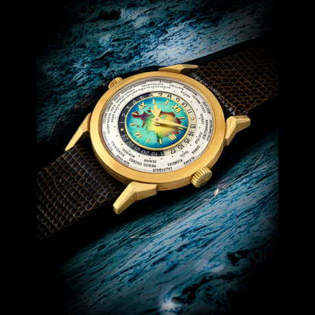PATEK PHILIPPE. AN EXCEPTIONAL, HIGHLY IMPORTANT AND EXTREMELY RARE 18K GOLD TWO-CROWN WORLD TIME WRISTWATCH WITH 24 HOUR INDICATION AND CLOISONN&#201; ENAMEL DIAL DEPICTING THE EURASIA MAP - photo 4