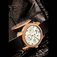 VACHERON CONSTANTIN. AN 18K PINK GOLD AUTOMATIC DUAL TIME WRISTWATCH WITH DATE, SWEEP SECONDS AND REGULATOR-STYLE DIAL