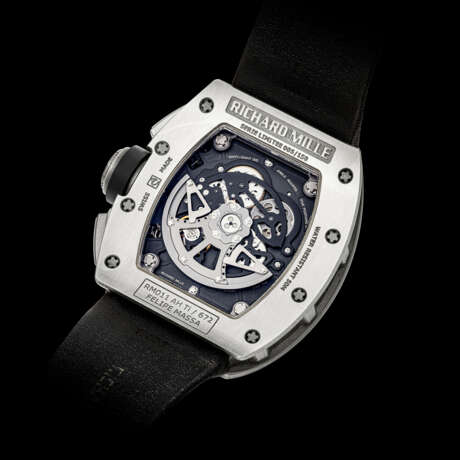 RICHARD MILLE. A RARE AND ATTRACTIVE TITANIUM LIMITED EDITION TONNEAU-SHAPED AUTOMATIC SEMI-SKELETONISED FLYBACK CHRONOGRAPH WRISTWATCH WITH ANNUAL CALENDAR - photo 2