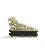 Yuan dynasty. A CELADON JADE &#39;DRAGON&#39; BRUSH REST