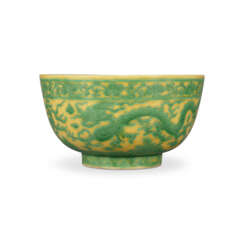 A RARE LARGE YELLOW-GROUND GREEN-ENAMELLED ‘DRAGON’ BOWL