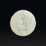 A WHITE JADE ‘DRAGON AND PHOENIX’ CIRCULAR PENDANT - photo 2