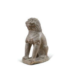 A LARGE LIMESTONE CARVING OF A SEATED LION