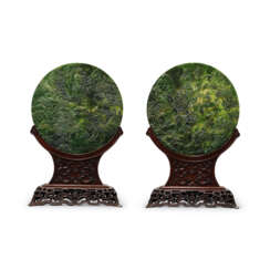 A PAIR OF LARGE SPINACH-GREEN JADE &#39;LANDSCAPE&#39; CIRCULAR TABLE SCREENS INSCRIBED WITH IMPERIAL POEMS