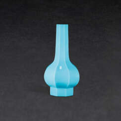 A BLUE GLASS OCTAGONAL BOTTLE VASE