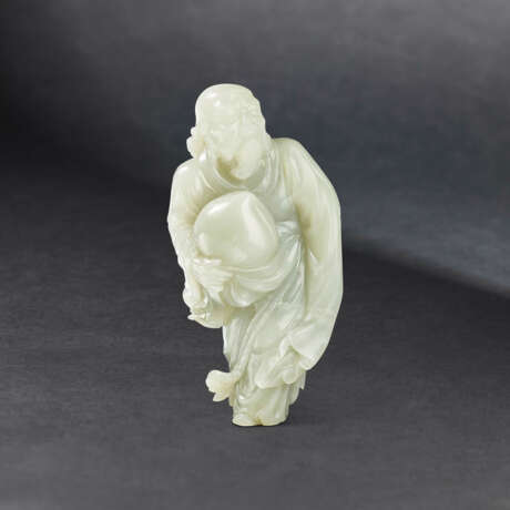 A LARGE CARVED PALE CELADON JADE FIGURE OF DONGFANG SHUO - photo 1