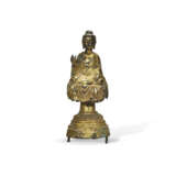 A RARE GILT-BRONZE FIGURE OF A SEATED BUDDHA - photo 1