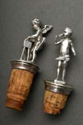 2 Diverse plastische Flaschenkorken, Metall versilbert, um 1900: Amoretten mit Schleifstein und Theatermaske, H.8,5/10cm, Gebrauchsspuren